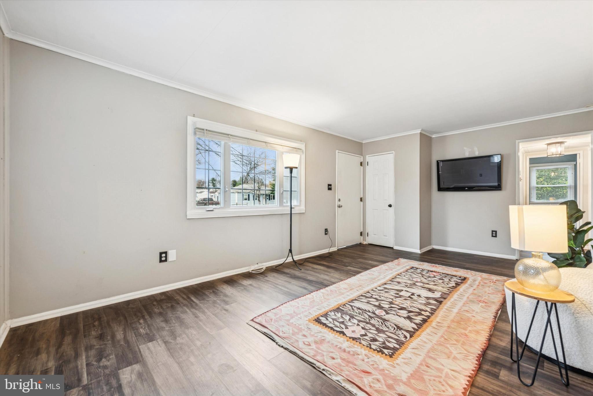 104 Lynbrook Road Paoli, PA 19301 - Photo 4 of 31 a view of an empty room window and wooden floor