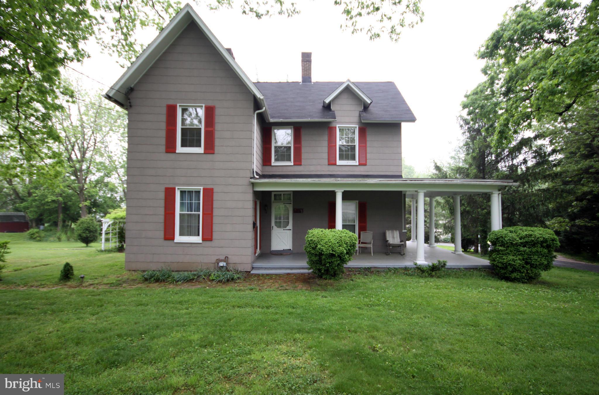 1610 South Rolling Road Baltimore, MD 21227 - Photo 1 of 19 a front view of a house with a yard and trees