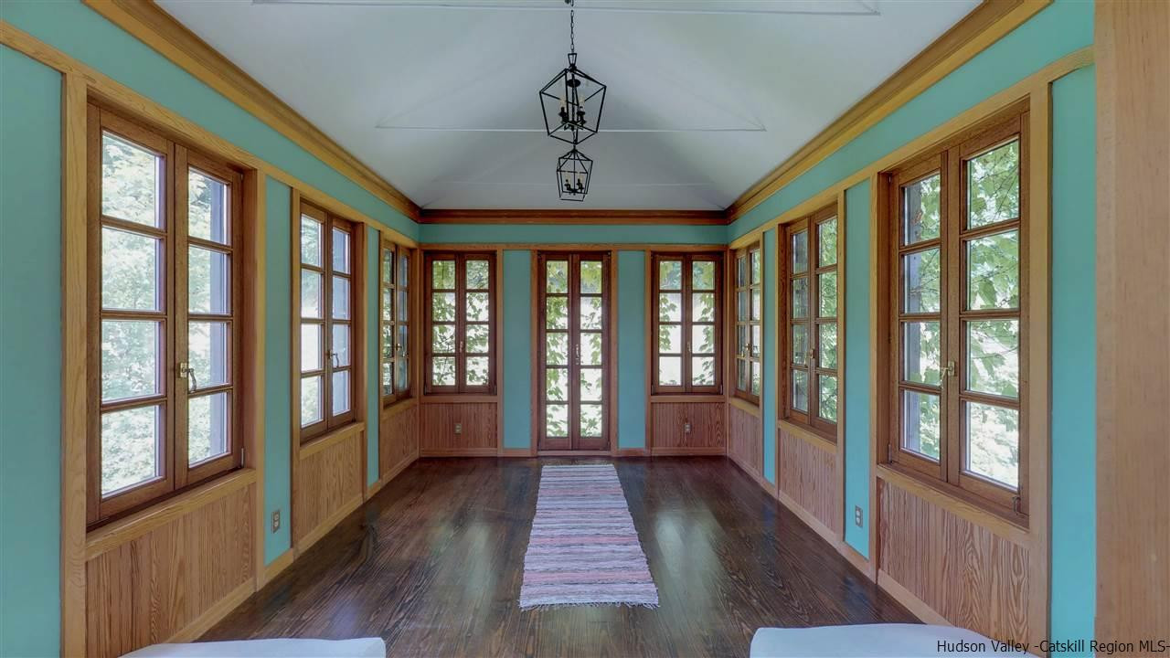 38 Frost Valley Road Claryville, NY 12725 - Photo 18 of 30 a view of a large room with wooden floor and windows