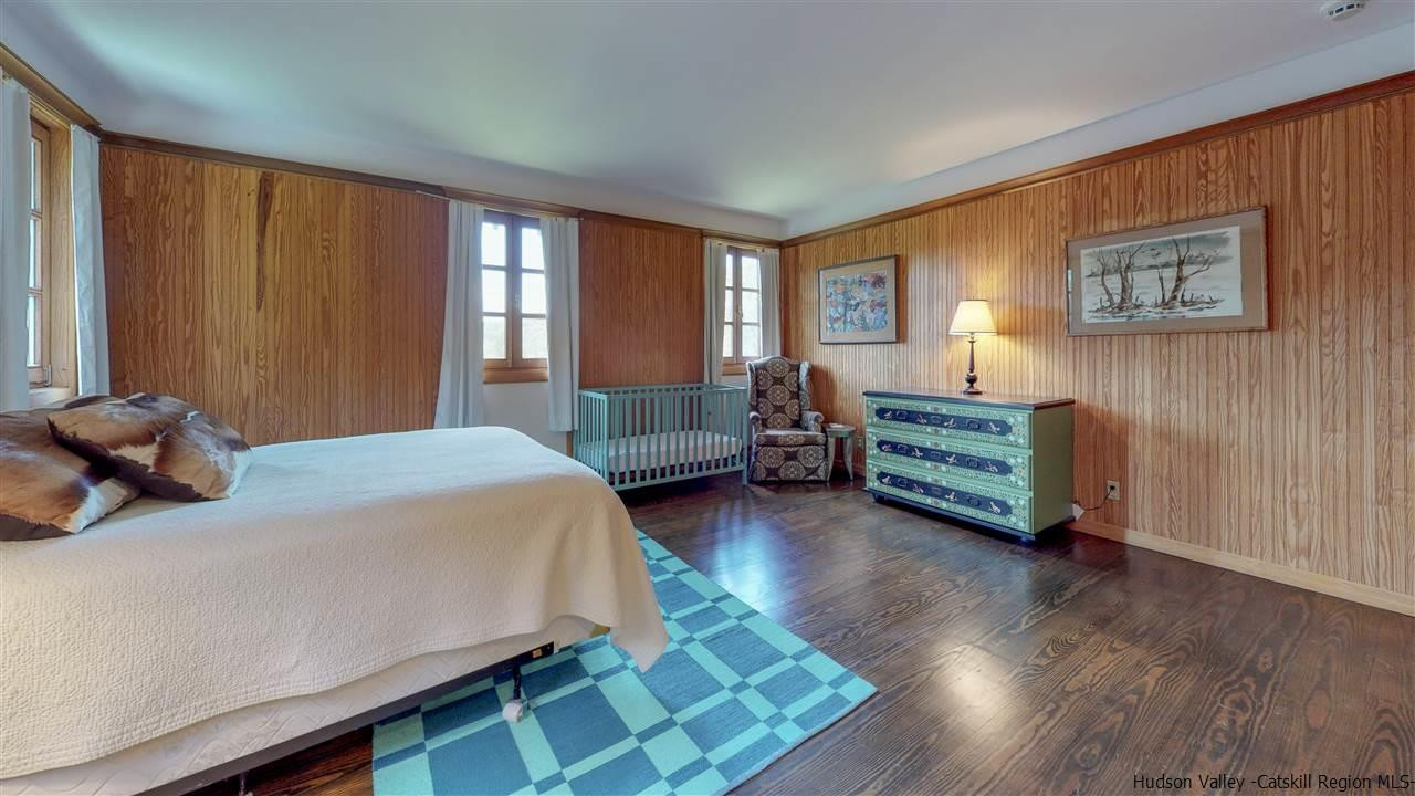 38 Frost Valley Road Claryville, NY 12725 - Photo 21 of 30 a bedroom with a bed and a dresser
