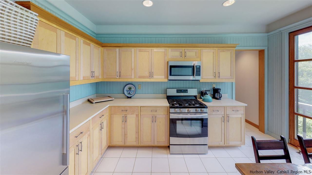38 Frost Valley Road Claryville, NY 12725 - Photo 9 of 30 a kitchen with a stove a sink and a refrigerator