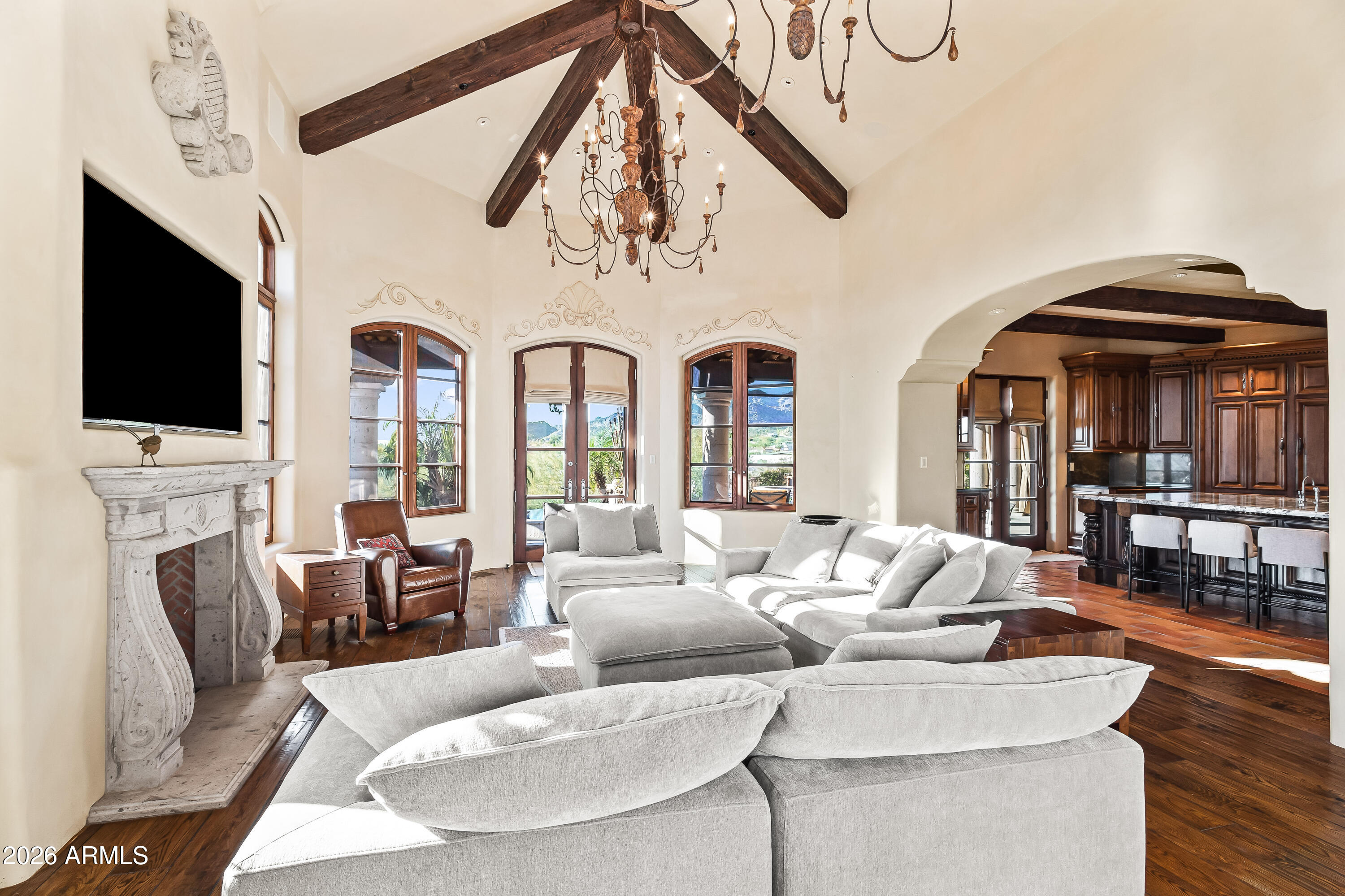 3900 East Bethany Home Road Paradise Valley, AZ 85253 - Photo 12 of 51 a living room with fireplace furniture and a flat screen tv