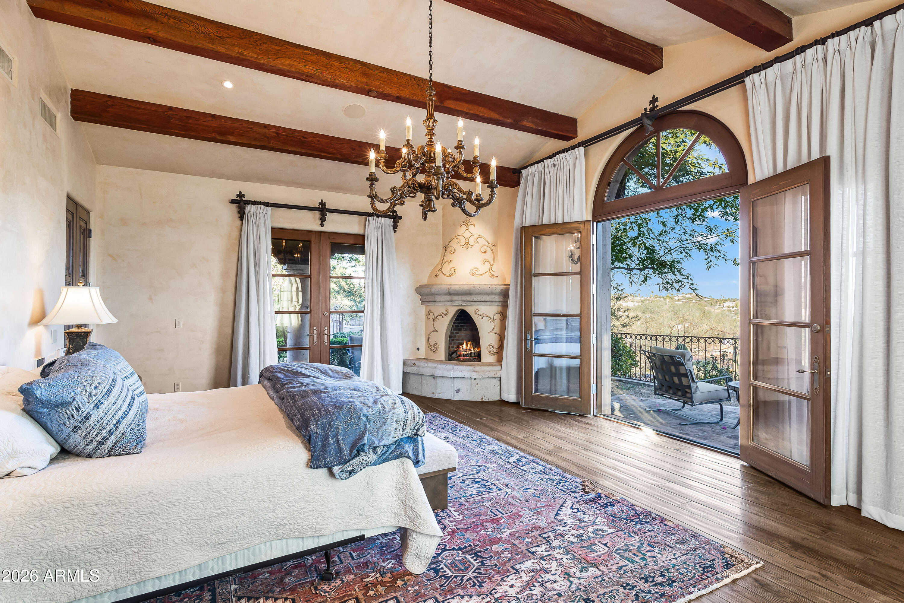 3900 East Bethany Home Road Paradise Valley, AZ 85253 - Photo 17 of 51 a large bedroom with a bed and a fireplace