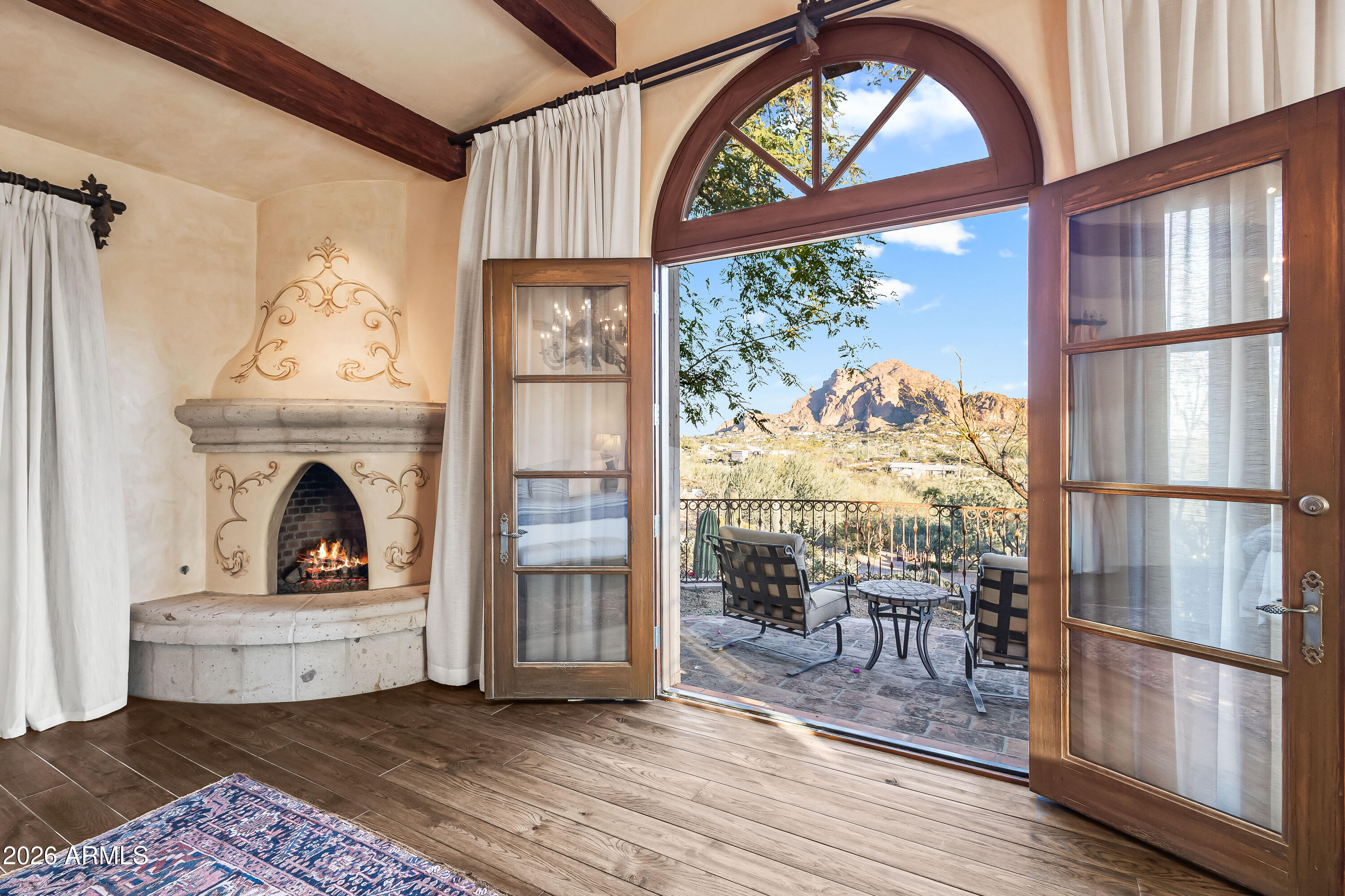 3900 East Bethany Home Road Paradise Valley, AZ 85253 - Photo 18 of 51 a living room with a fireplace furniture and a large window
