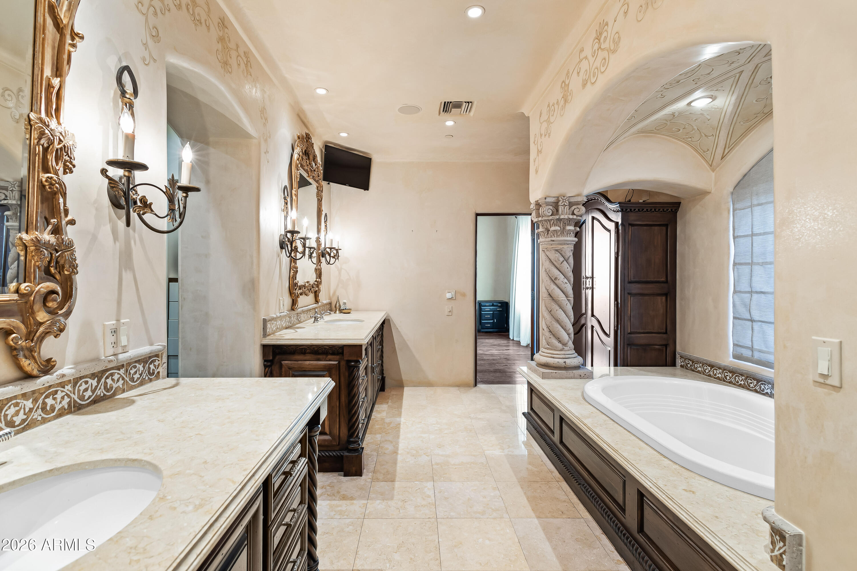 3900 East Bethany Home Road Paradise Valley, AZ 85253 - Photo 22 of 51 a bathroom with a granite countertop sink a mirror and a shower