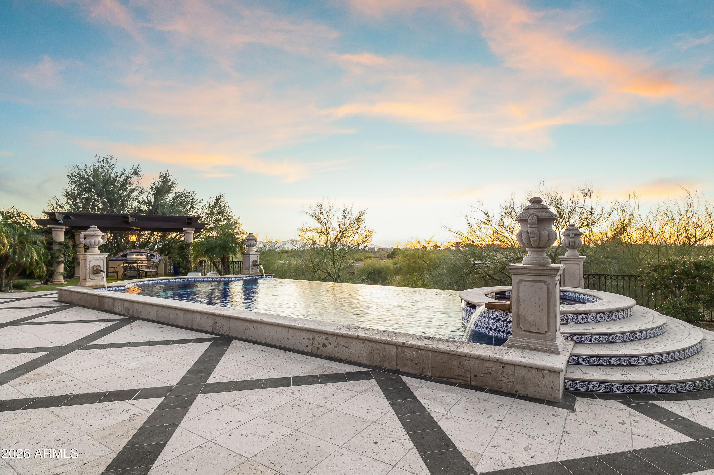 3900 East Bethany Home Road Paradise Valley, AZ 85253 - Photo 24 of 51 a view of a fountain in the middle of a house