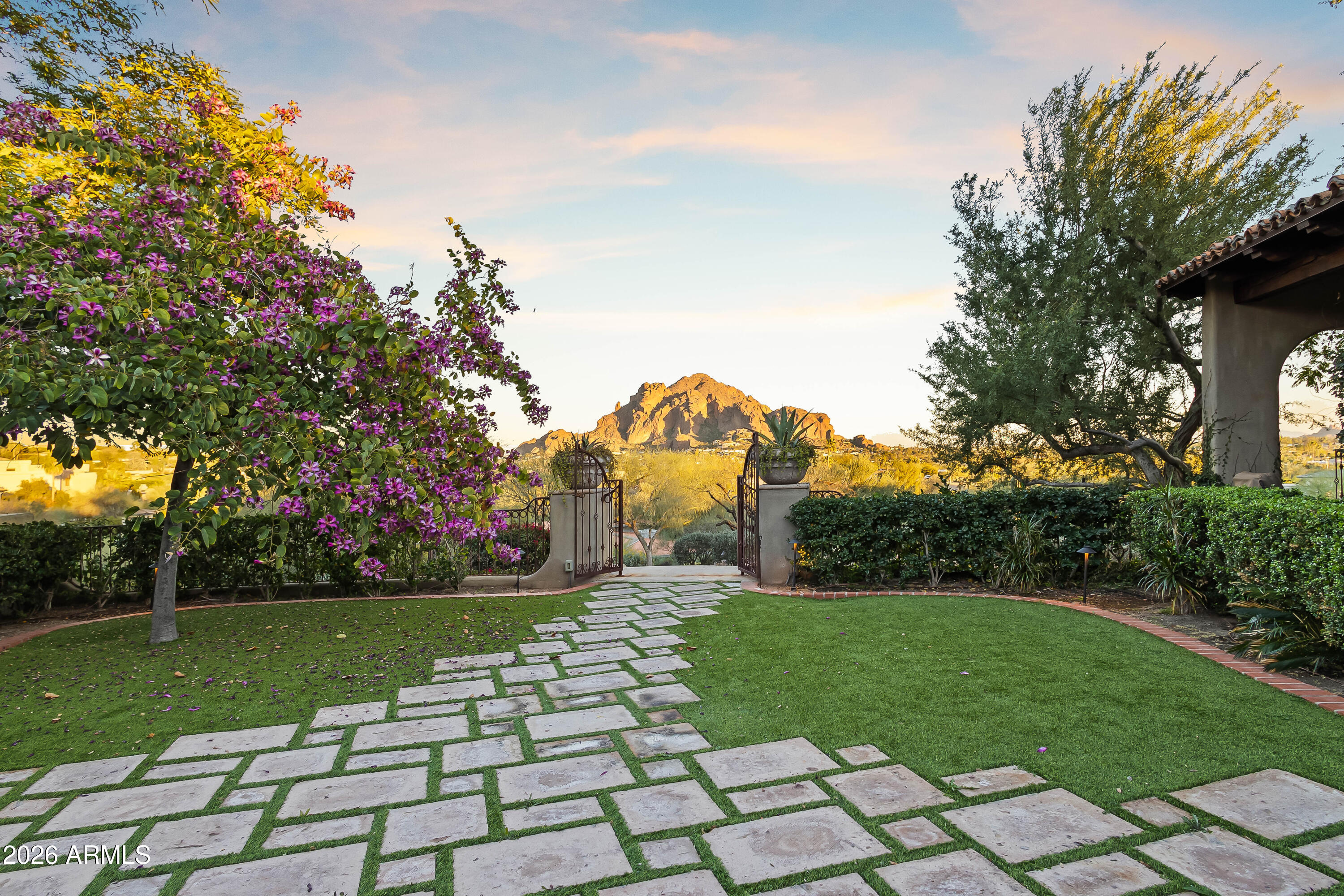 3900 East Bethany Home Road Paradise Valley, AZ 85253 - Photo 3 of 51 a view of a garden with a fountain