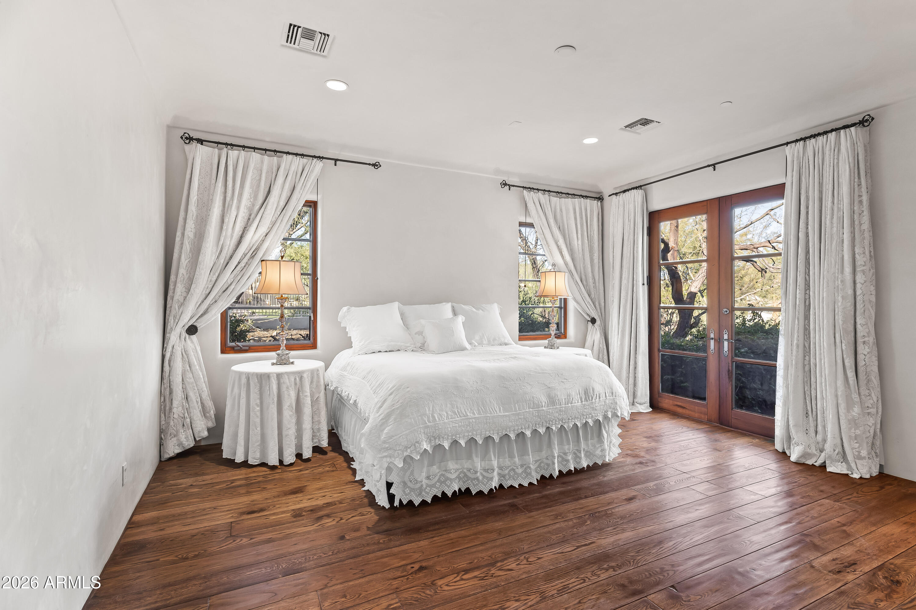 3900 East Bethany Home Road Paradise Valley, AZ 85253 - Photo 32 of 51 a bedroom with a bed and a large window