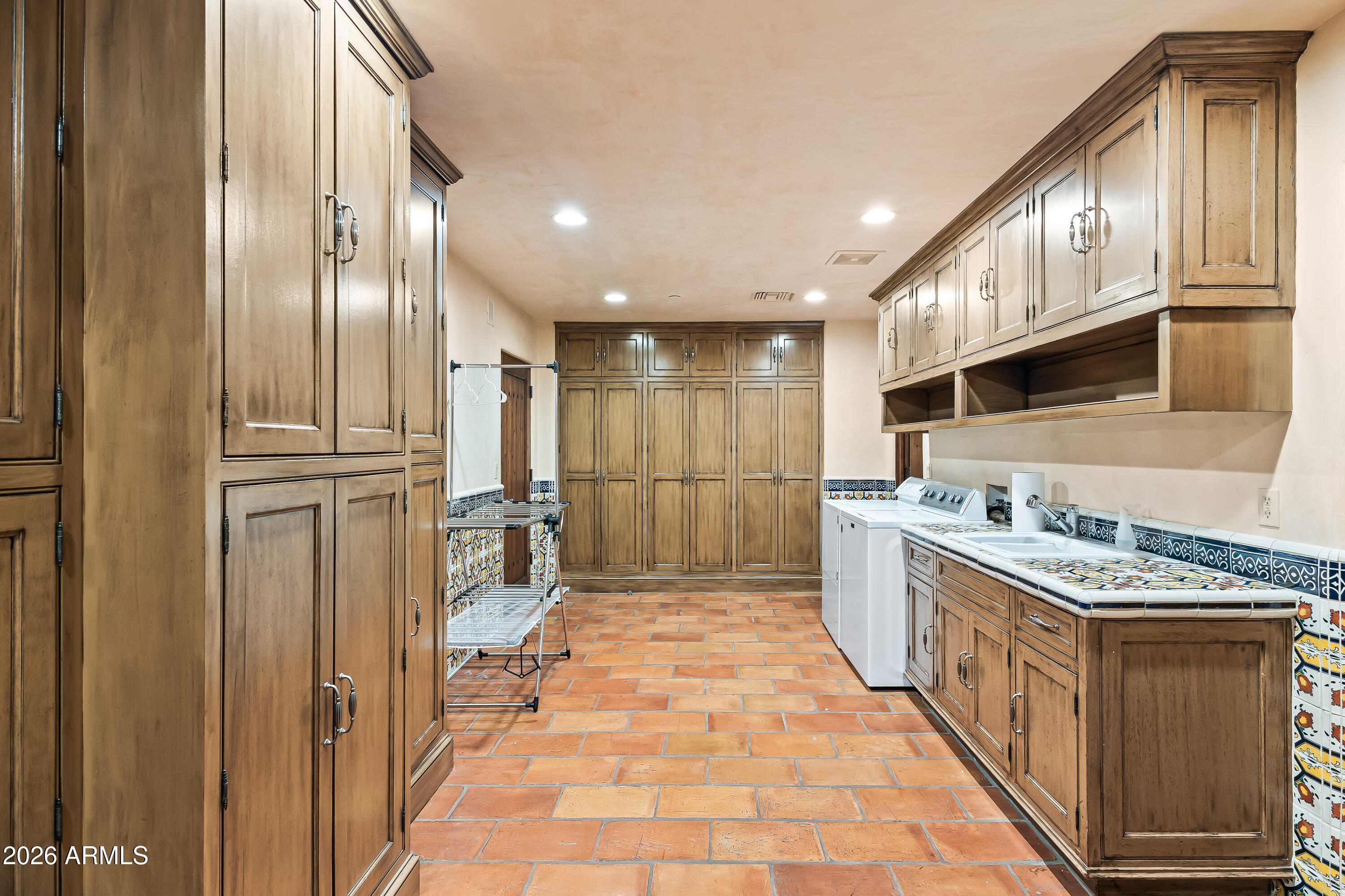 3900 East Bethany Home Road Paradise Valley, AZ 85253 - Photo 38 of 51 a kitchen with stainless steel appliances granite countertop a refrigerator and a stove