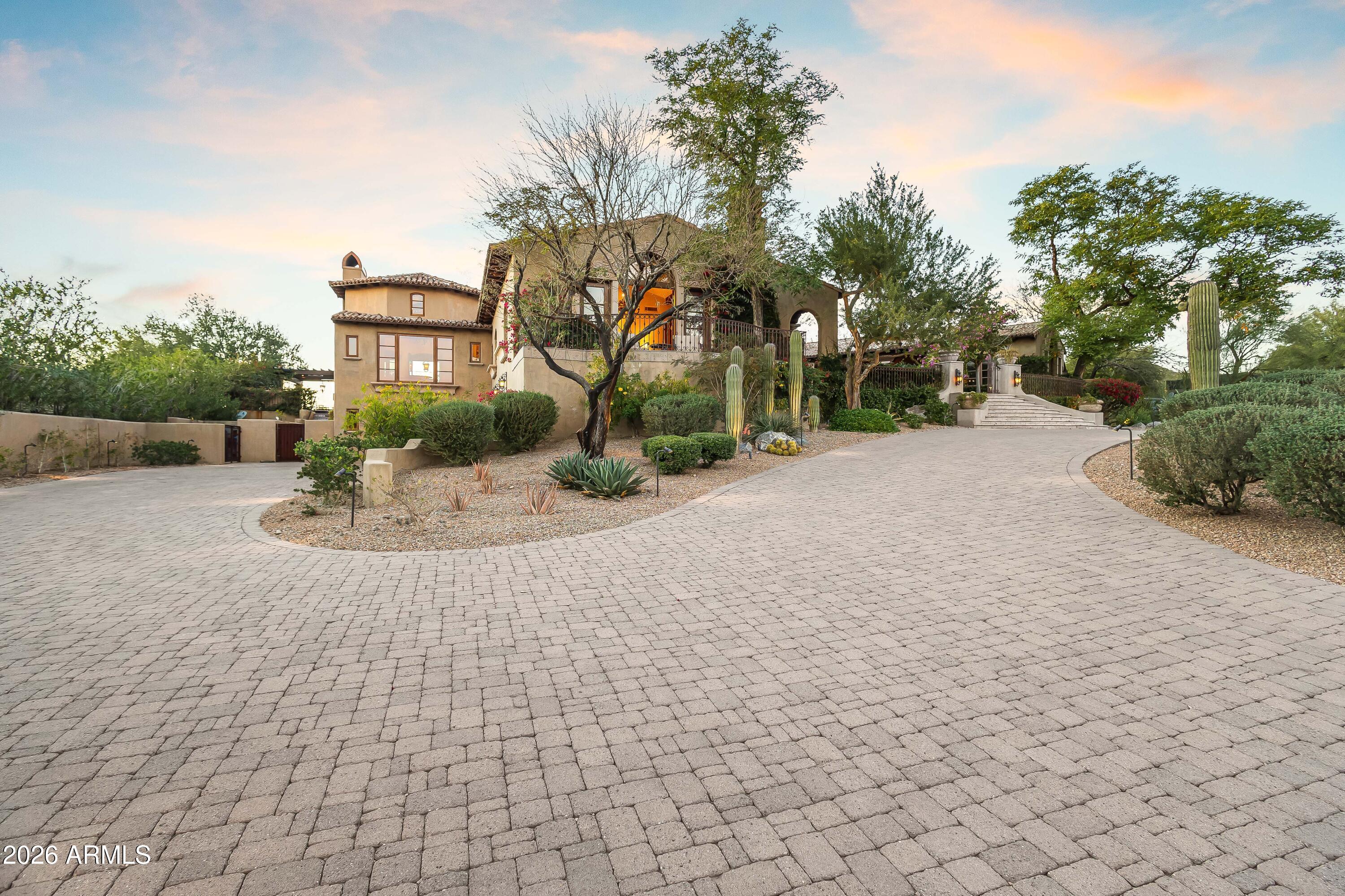 3900 East Bethany Home Road Paradise Valley, AZ 85253 - Photo 46 of 51 a view of a house with a yard and potted plants