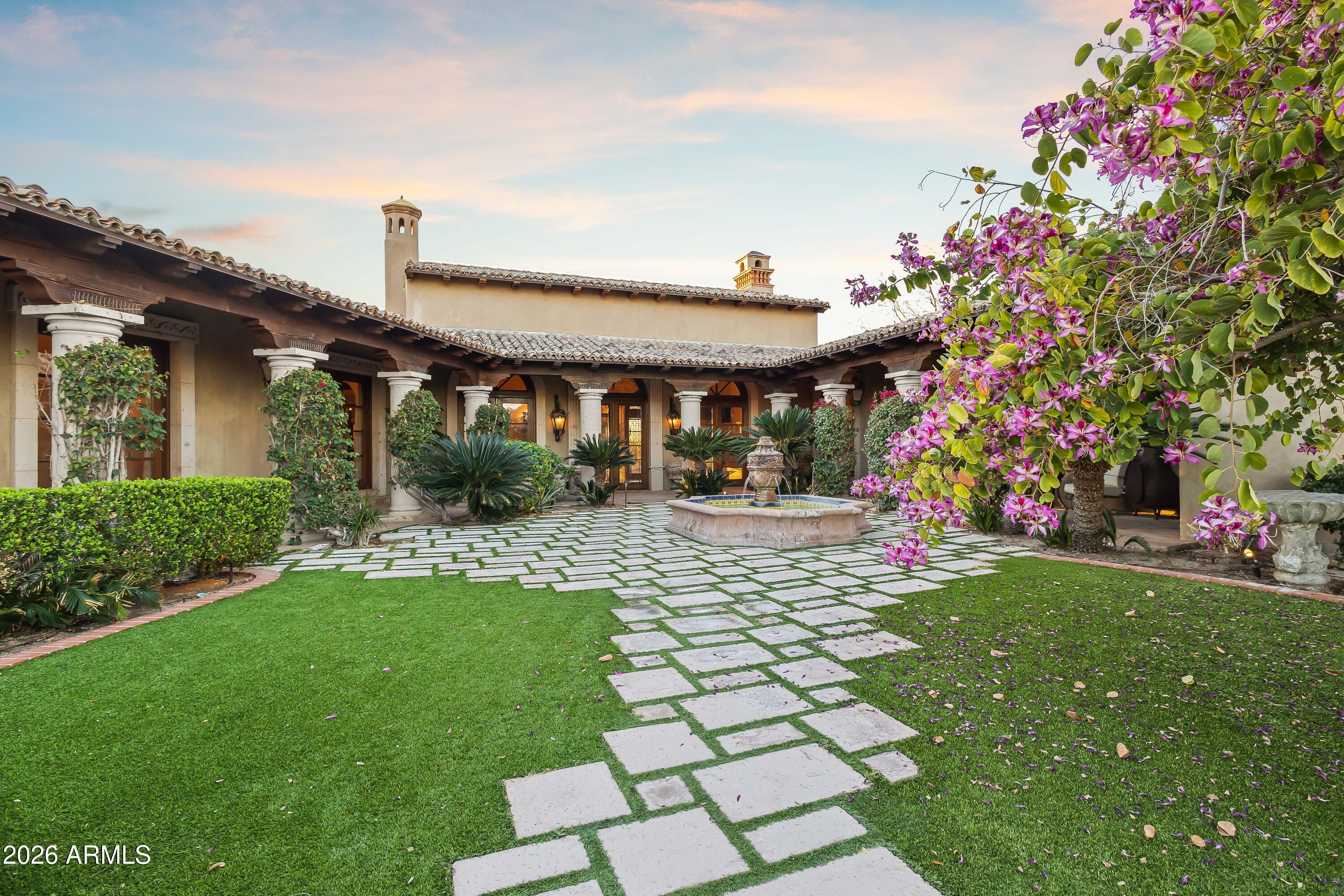 3900 East Bethany Home Road Paradise Valley, AZ 85253 - Photo 5 of 51 a front view of a house with a yard