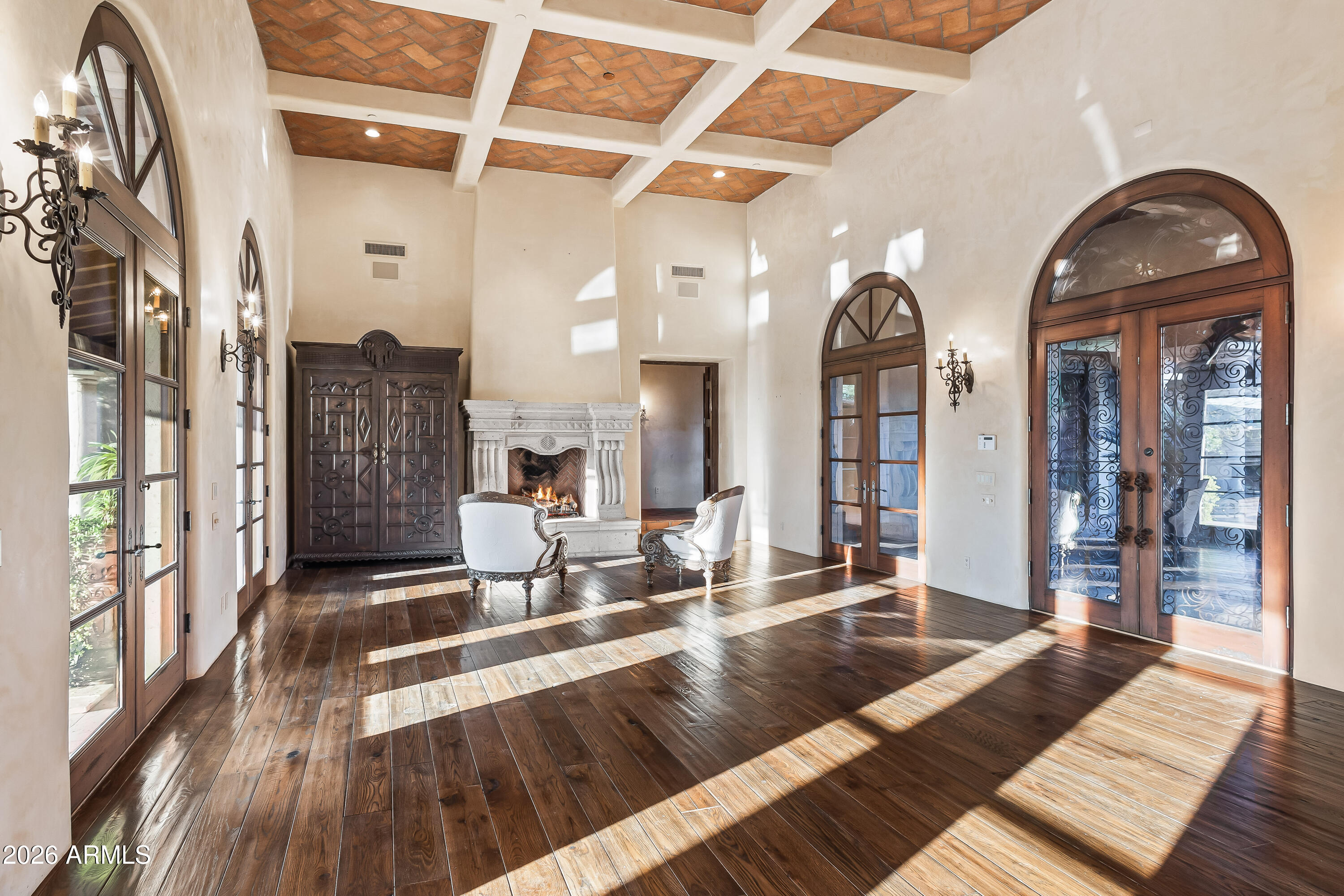 3900 East Bethany Home Road Paradise Valley, AZ 85253 - Photo 8 of 51 a living room with furniture and a fireplace