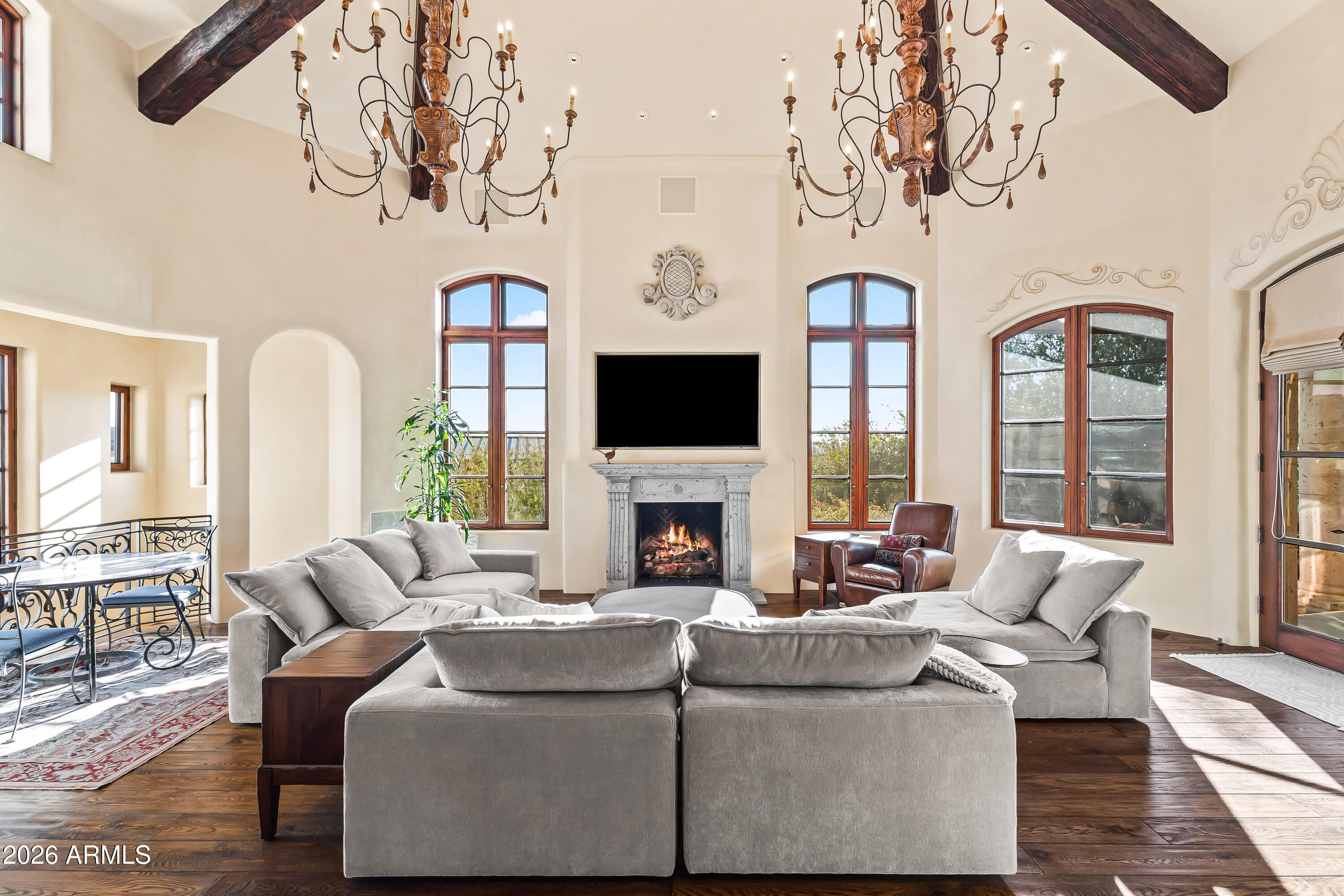 3900 East Bethany Home Road Paradise Valley, AZ 85253 - Photo 10 of 51 a living room with fireplace furniture and a flat screen tv
