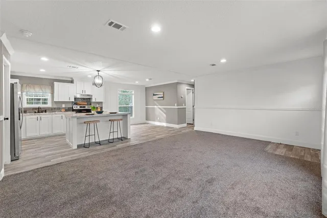 a view of kitchen and refrigerator