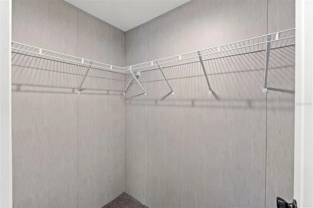 an empty room with a empty space and windows