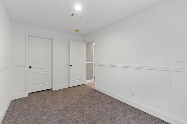 a view of a hallway with closet
