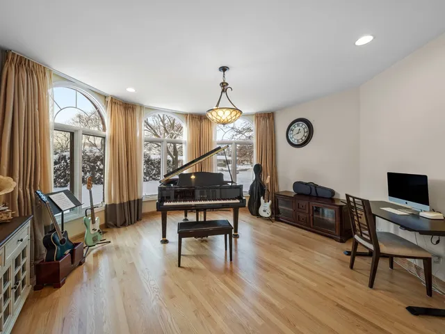 a bedroom with a bed and a table with chair