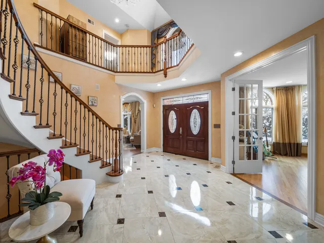 a view of entryway dining room and hall with wooden floor
