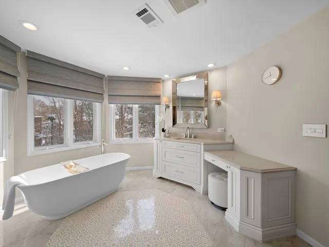 a view of an empty room with closet and a window