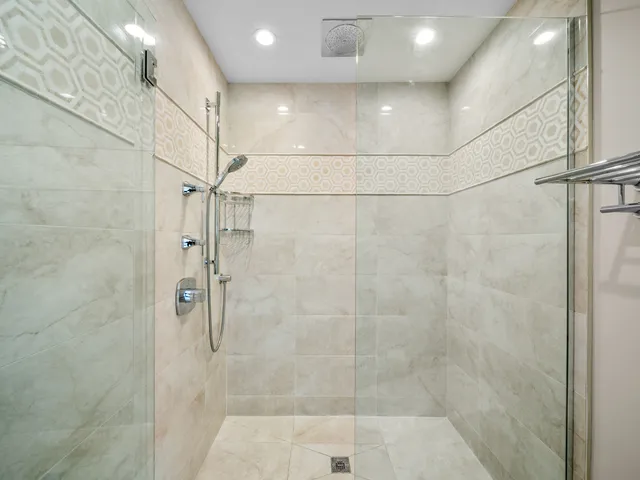 a view of empty room with wooden floor and window