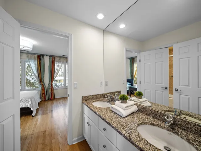 a living room with furniture and a projector screen