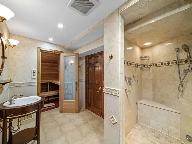 a picture of a bench in front of a building