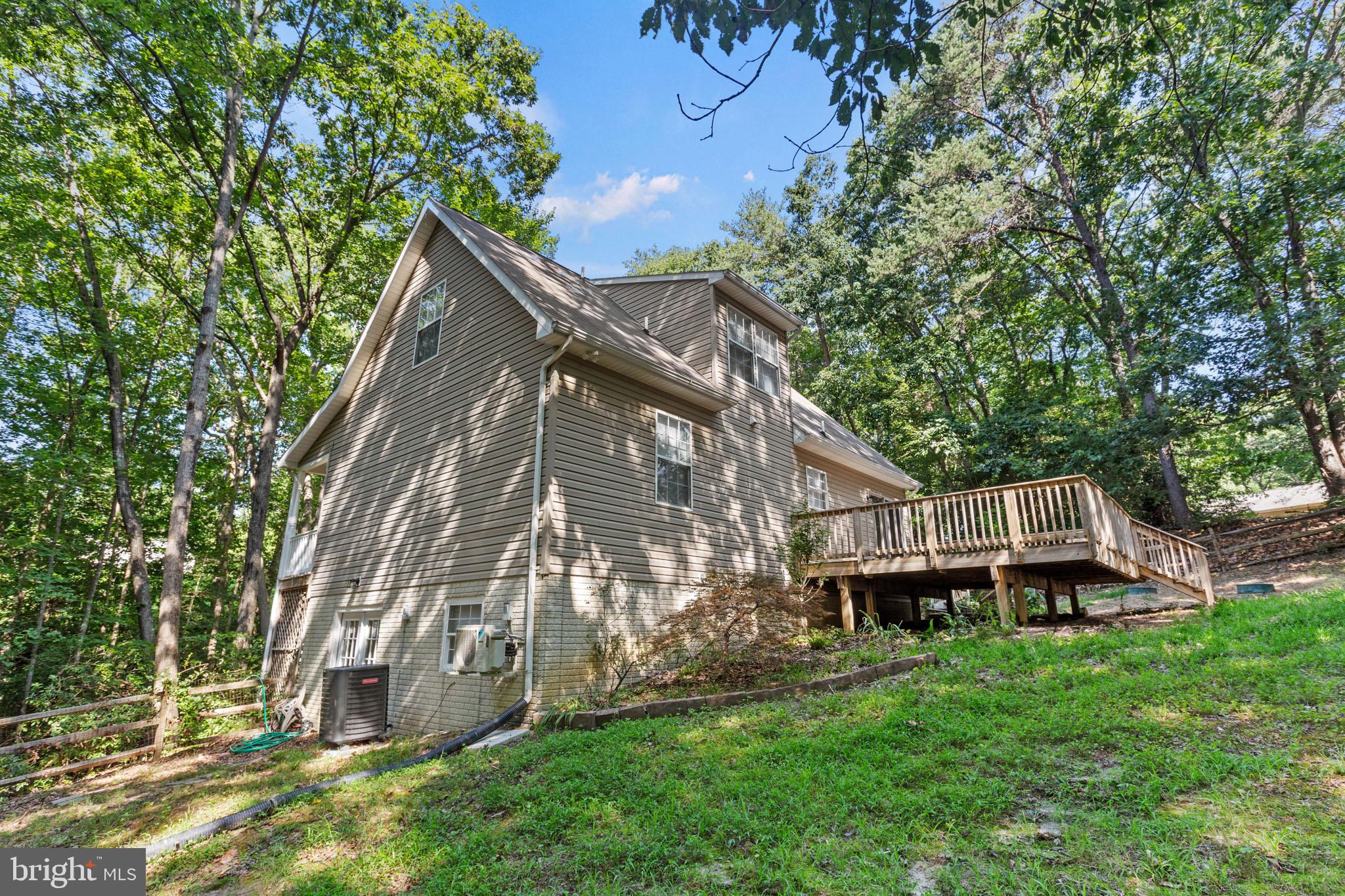 7830 Pine Boulevard Lusby, MD 20657 - Photo 30 of 30 a house with trees in the background