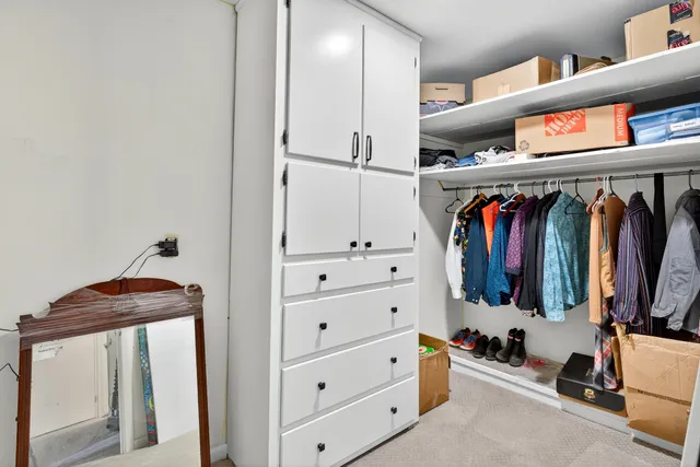 a view of a house with a yard and tree s