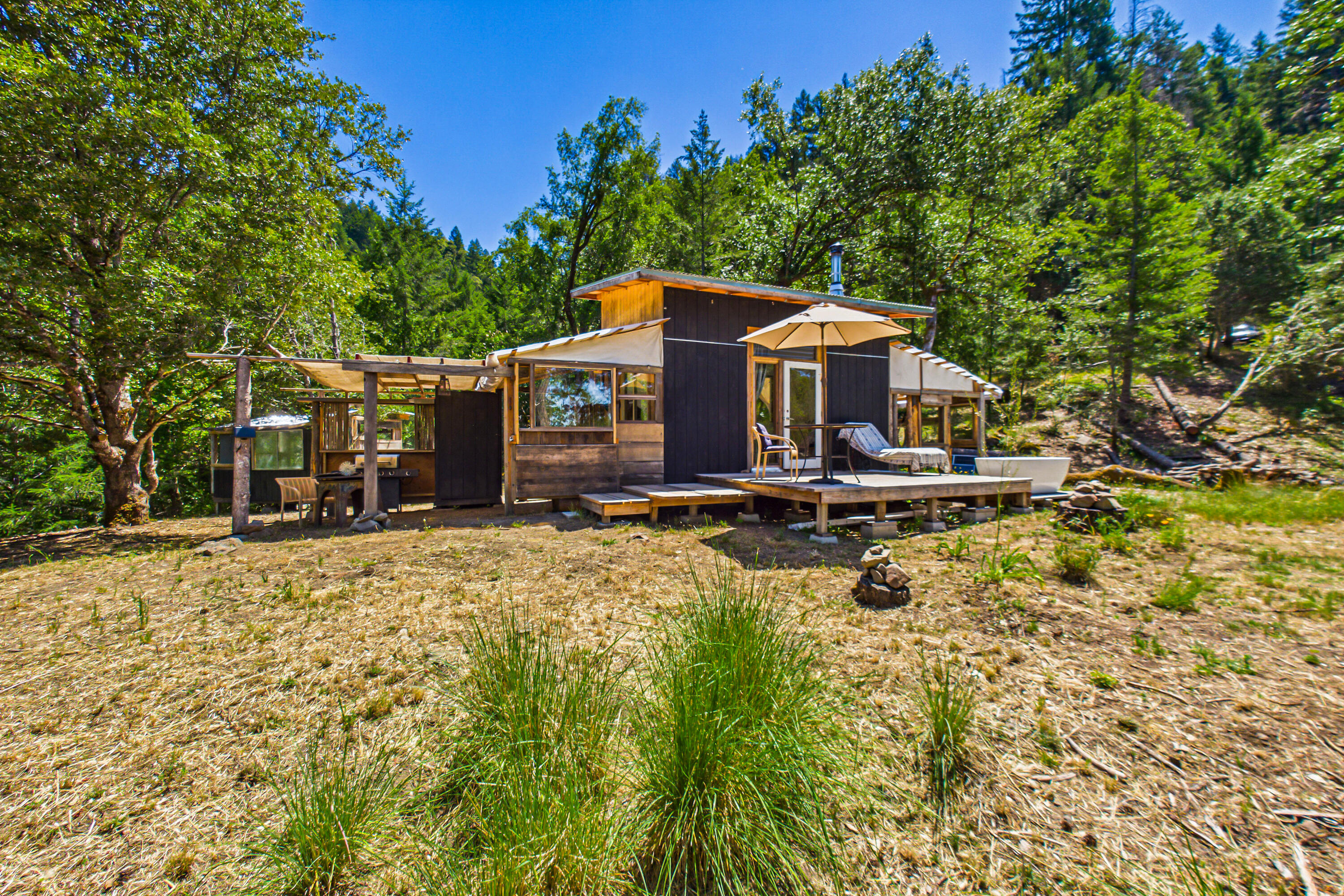 60890 Bell Springs Road Laytonville, CA 95454 - Photo 20 of 77 a front view of a house with a yard