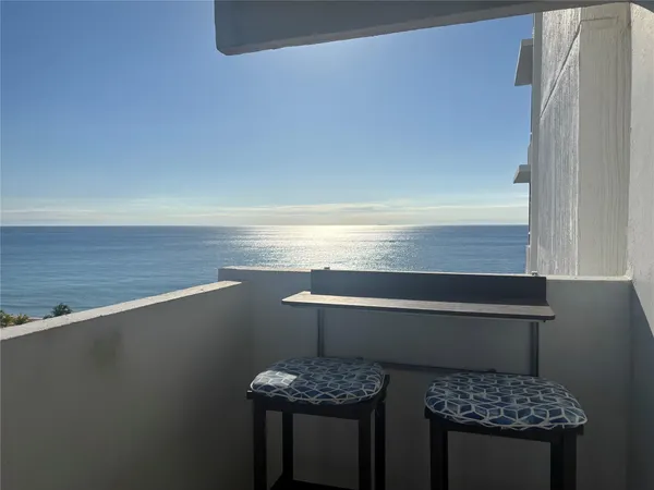 a view of table and chair in the room