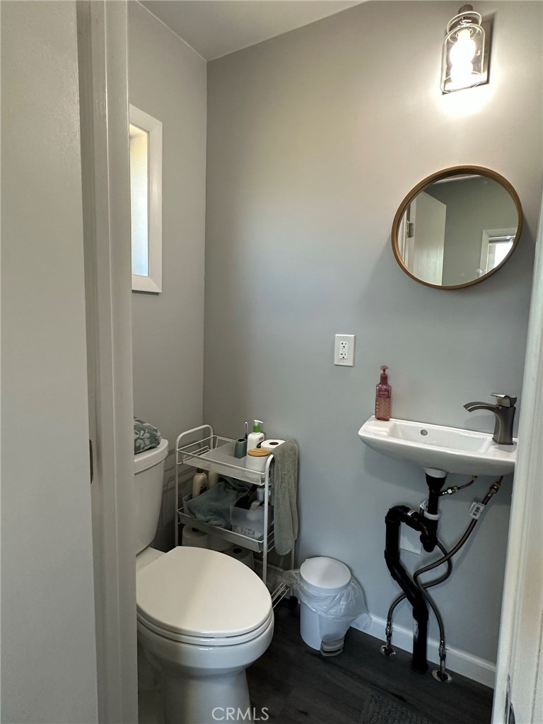 622 Broadway Gilroy, CA 95020 - Photo 5 of 6 a bathroom with a toilet a sink and a mirror