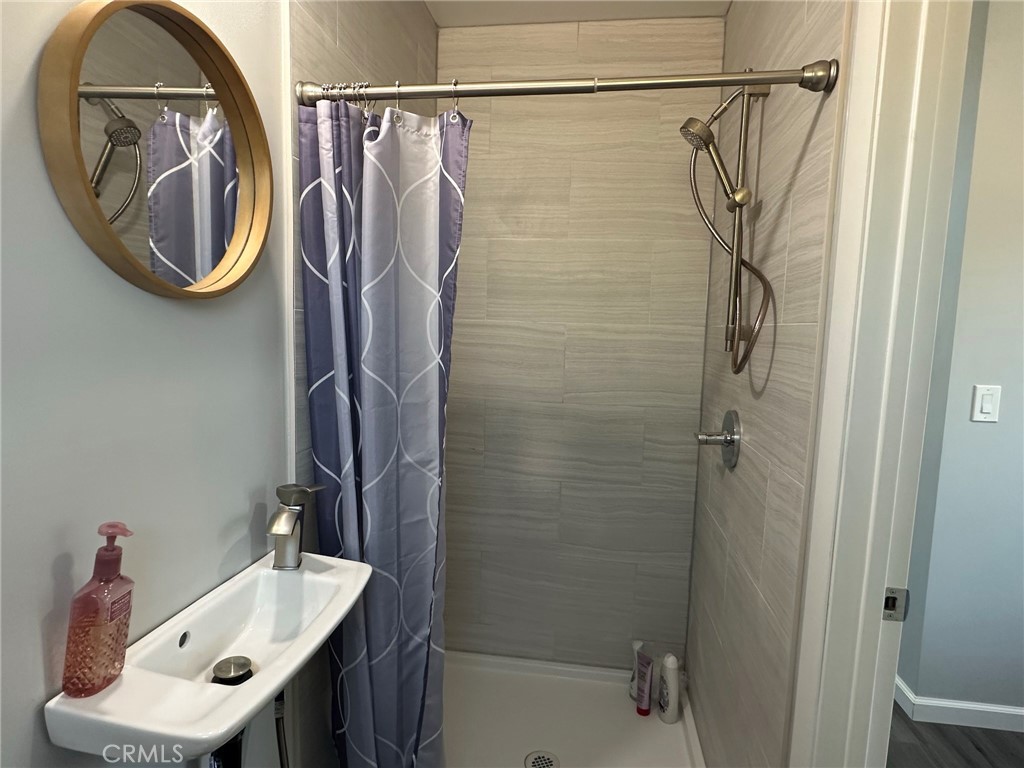 622 Broadway Gilroy, CA 95020 - Photo 6 of 6 a bathroom with a sink and a mirror