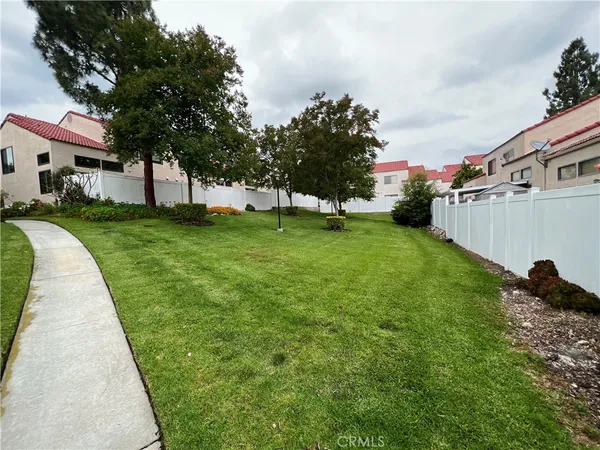 a kitchen with cabinets appliances and a counter space