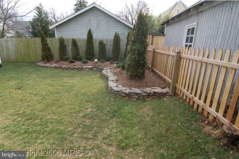 4416 Ridge Street Chevy Chase, MD 20815 - Photo 14 of 20 a front view of a house with garden