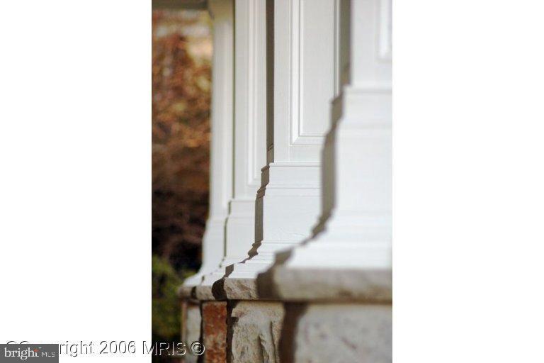 4416 Ridge Street Chevy Chase, MD 20815 - Photo 15 of 20 a view of staircase with white walls