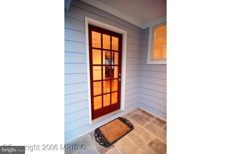 4416 Ridge Street Chevy Chase, MD 20815 - Photo 17 of 20 a view of a room that has a window and front door