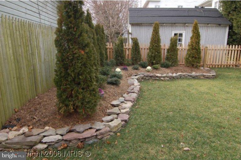 4416 Ridge Street Chevy Chase, MD 20815 - Photo 19 of 20 a view of a house with a yard