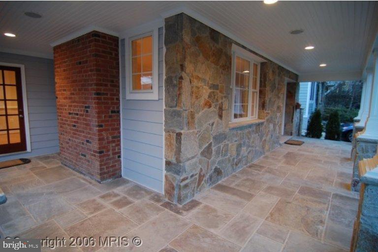 4416 Ridge Street Chevy Chase, MD 20815 - Photo 3 of 20 a view of front door of house with yard