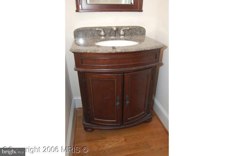 4416 Ridge Street Chevy Chase, MD 20815 - Photo 9 of 20 a bathroom with a sink and a mirror