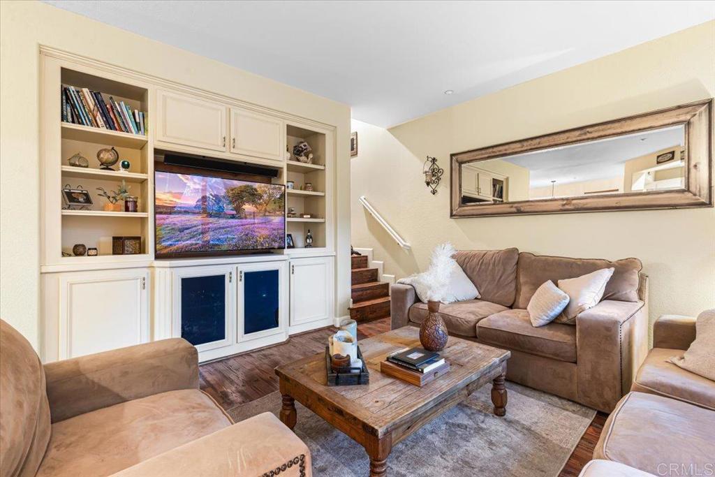 1101 Goddard Street San Marcos, CA 92078 - Photo 16 of 38 a living room with furniture kitchen view and a fireplace