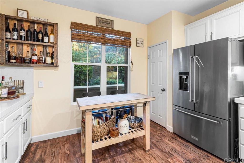 1101 Goddard Street San Marcos, CA 92078 - Photo 25 of 38 a kitchen with stainless steel appliances a refrigerator and a stove top oven
