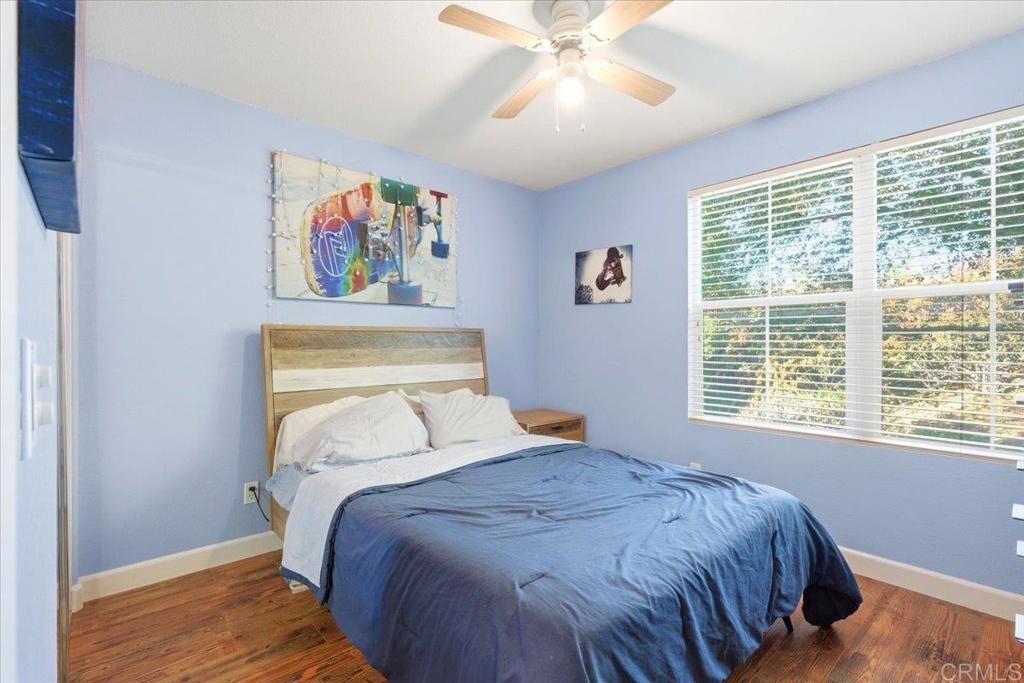 1101 Goddard Street San Marcos, CA 92078 - Photo 27 of 38 a bedroom with a bed and a window