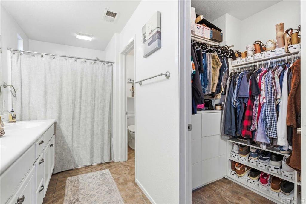 1101 Goddard Street San Marcos, CA 92078 - Photo 34 of 38 a view of walk in closet with clothes