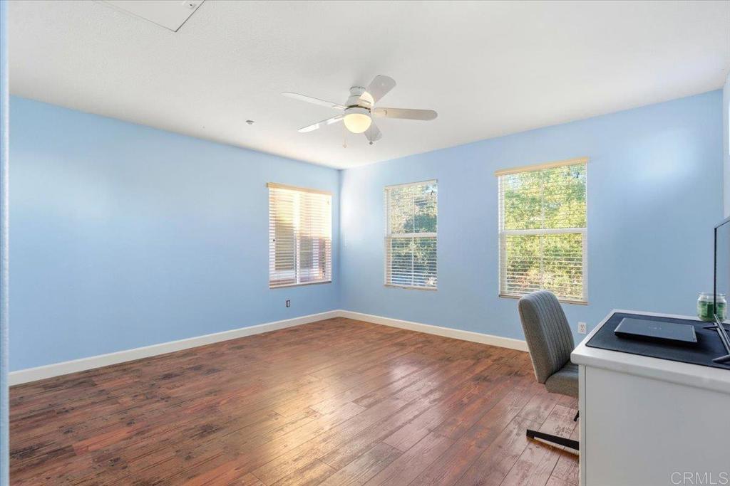 1101 Goddard Street San Marcos, CA 92078 - Photo 36 of 38 a workspace with wooden floor and windows