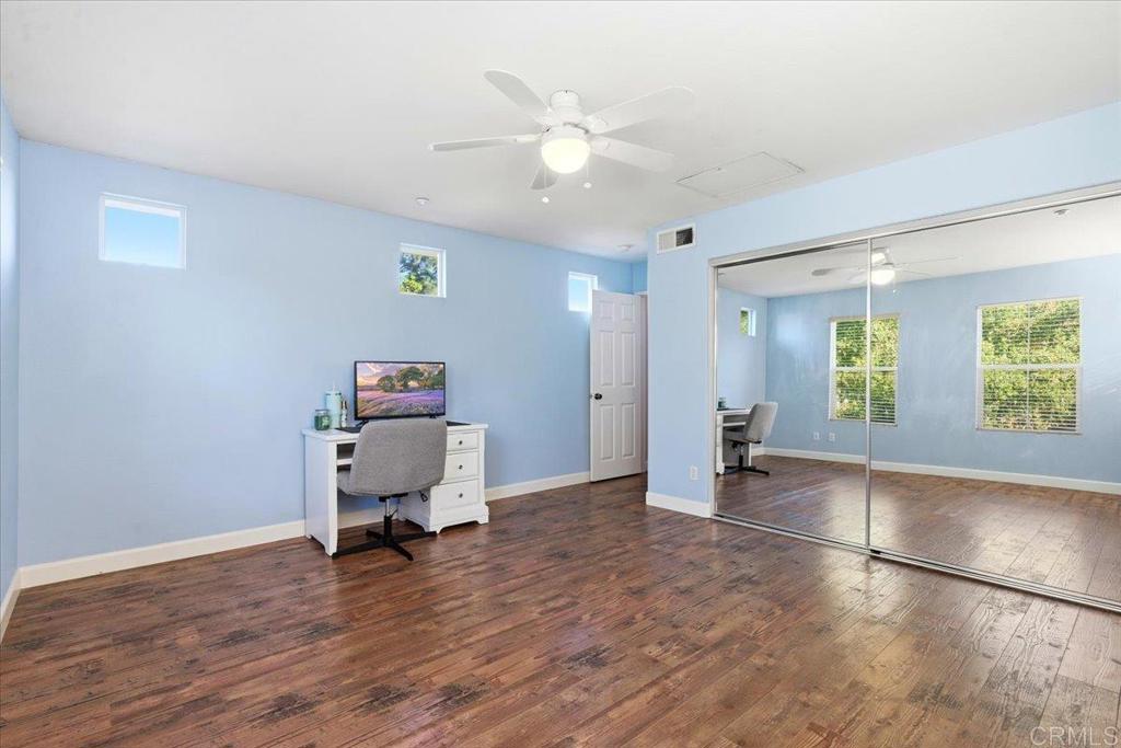 1101 Goddard Street San Marcos, CA 92078 - Photo 37 of 38 a work room with furniture and wooden floor