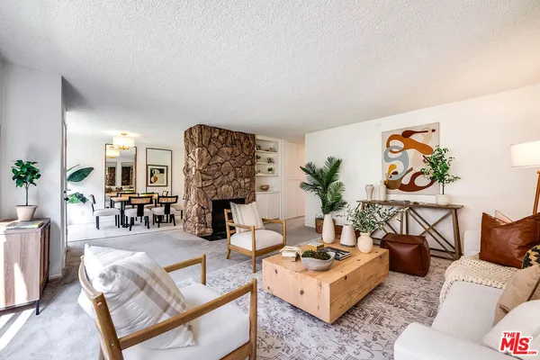 a living room with furniture and a couch