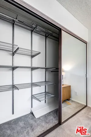 a view of a room with racks on the wall