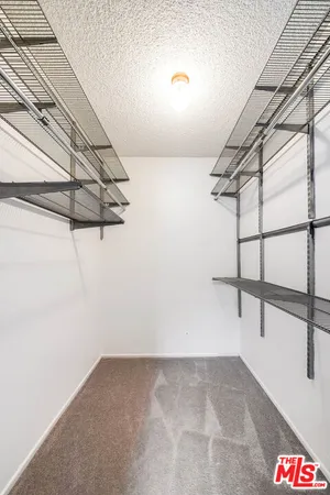 a view of a room with racks on the wall