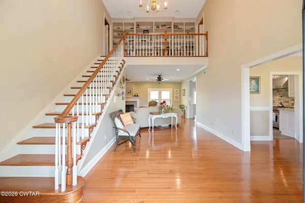a living room with furniture ceiling fan and a rug