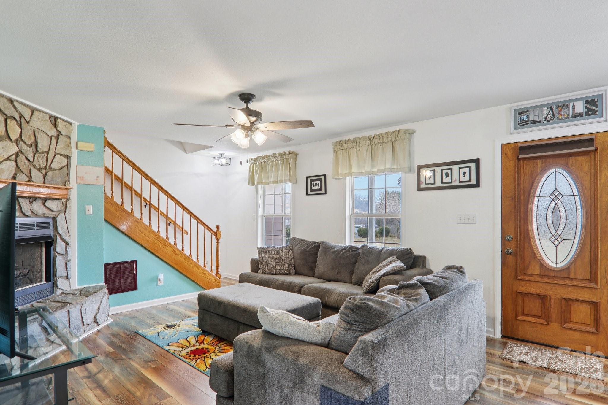 130 Crestview Street Canton, NC 28716 - Photo 11 of 42 a living room with furniture and a chandelier